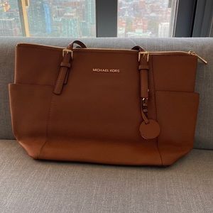 Brown Michael Kors bag.